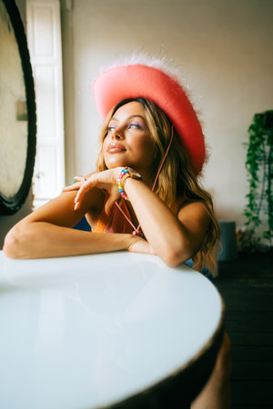 Portrait of attractive caucasian woman fashion model with blonde hair in pink cowboys hat , posingの写真素材