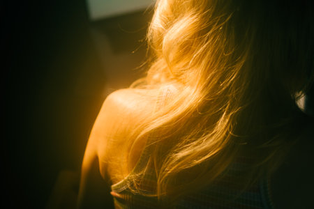 Caucasian woman with blonde hair, close up hair curls with copy space.の写真素材