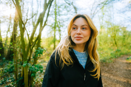 Portrait of attractive caucasian woman hiking in a forest.の写真素材