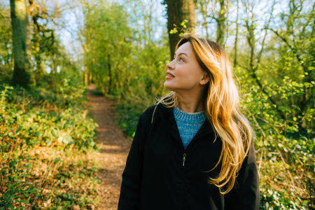 Portrait of attractive caucasian woman hiking in a forest.の写真素材