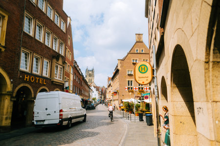 Old town street and Bus stop near Prinzipal market in Munster.のeditorial素材
