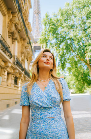 Portrait of young attractive woman fashion model posing near Eiffel Tower in Paris .の写真素材