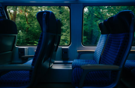 Interior detail of German regional train, large window and empty seatsの写真素材