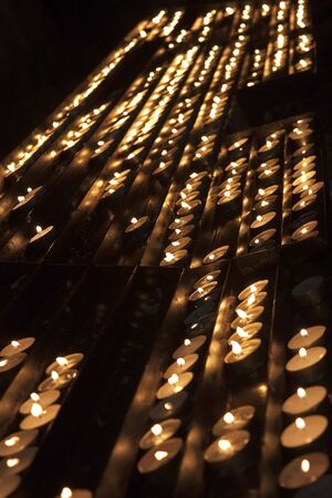 Rows of candles inside the cathedral.のeditorial素材