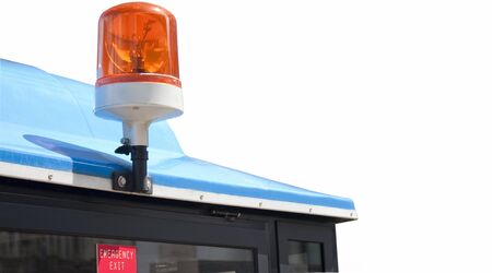 Orange light bulb above the emergency exit on the public vehicle.の写真素材
