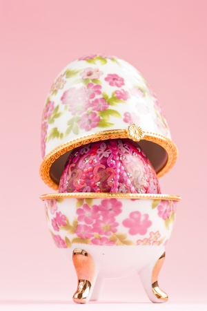 Porcelain egg decoration with Easter egg inside.の写真素材