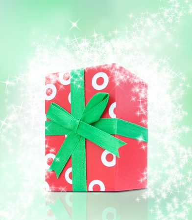 Red present with dots and green ribbonの写真素材