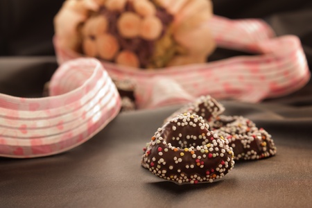 Heart shaped gingerbread cookies with chocolate and colorful frosting.の写真素材