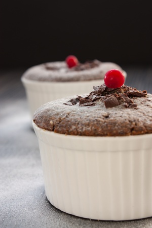 Chocolate souffle with chocolate chips and red currantの写真素材