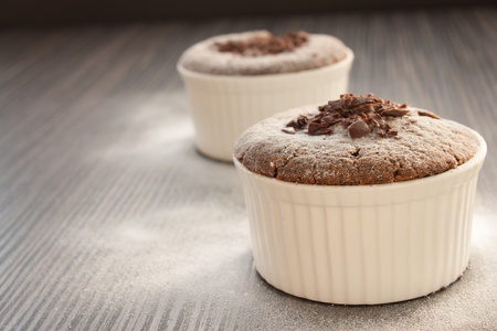 Chocolate souffle with chocolate chips and red currantの写真素材