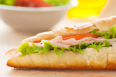 Ham and cheese sandwich with lettuce and tomato.の写真素材