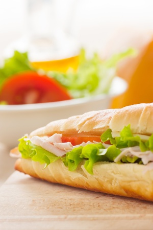 Ham and cheese sandwich with lettuce and tomato.の写真素材