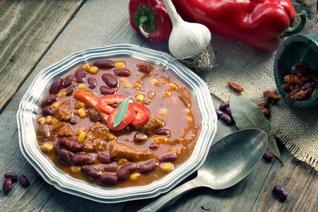 Chili con carne plate. Mexican traditional dish in rustic settingの写真素材