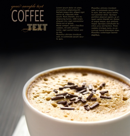 Capuccino in white cup  with chocolate sprinklesの写真素材