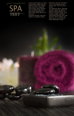 Spa setting with volcanic pebbles and massage stones.の写真素材