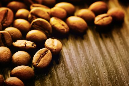 Coffee beans background macro shot on wooden background with copyspaceの写真素材