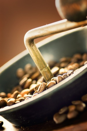 Coffee beans in the rustic old coffee grinder.の写真素材