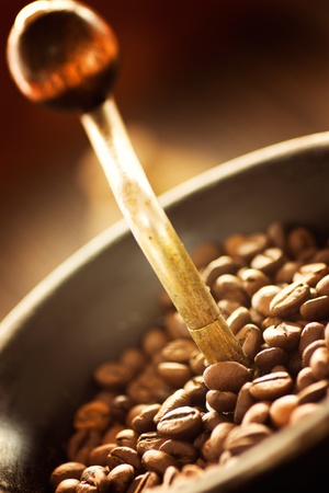 Coffee beans in the rustic old coffee grinder.の写真素材