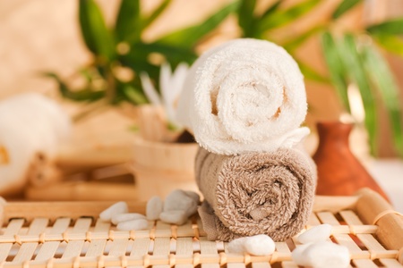 Spa setting with two towels and pebblesの写真素材