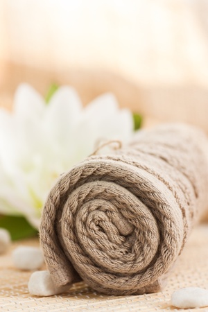 Spa setting with towel andlotus flower.の写真素材