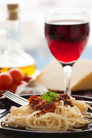 Spaghetti with tomato sauce, capers and anchovies.の写真素材