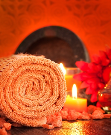 Spa setting  in orange tones  with candlesの写真素材
