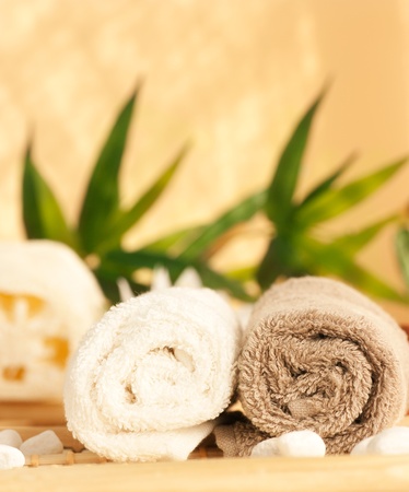 Spa setting with two towels and pebblesの写真素材