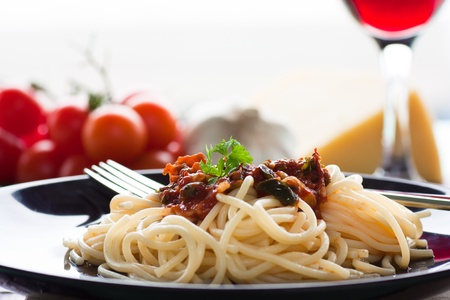 Spaghetti with tomato sauce, capers and anchovies.の写真素材