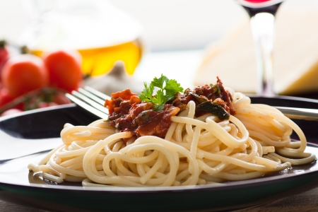 Spaghetti with tomato sauce, capers and anchovies.の写真素材