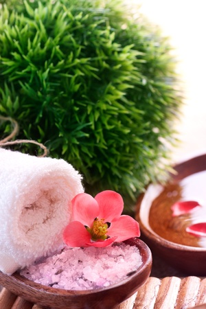 Spa setting with bath salt and towel.の写真素材