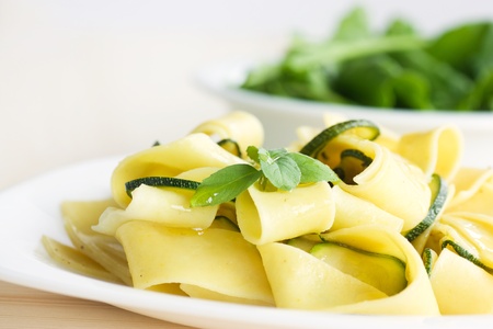 Tagliatelle pasta with zucchini, garlic and olive oil.の写真素材