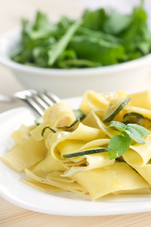 Tagliatelle pasta with zuccini, garlic and olive oil.の写真素材