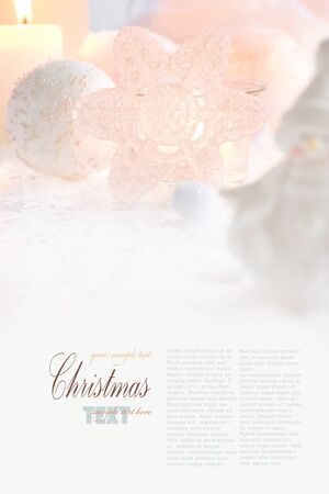 Christmas table setting. Fork and knife in elegant holiday setting with snow and white ornamentsの写真素材