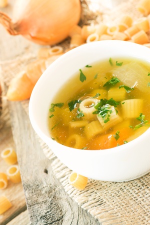 Vegetable soup with pasta and garnishの写真素材