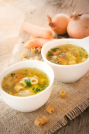 Vegetable soup with pasta and garnishの写真素材
