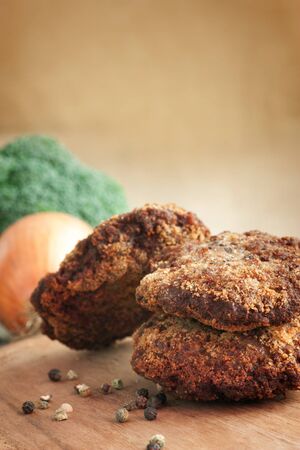 Fried minced meat steaks with vegetablesの写真素材