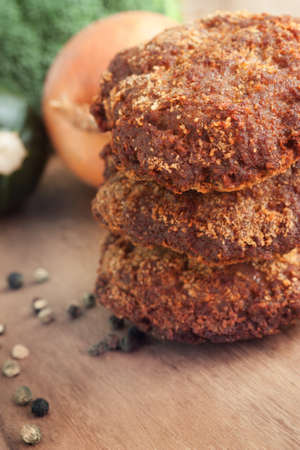 Fried minced meat steaks with vegetablesの写真素材