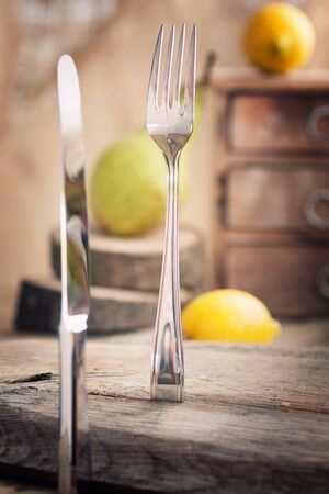 Restaurant menu series  Country place setting  Fork and knife in rustic country table setting  settingの写真素材