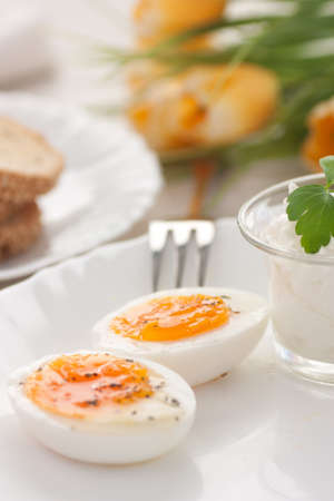 Traditional Easter breakfast. Table setting with Boiled eggs and cottage cheese