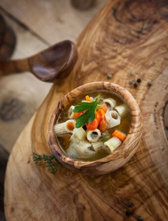 Vegetable soup with pasta and garnishの写真素材