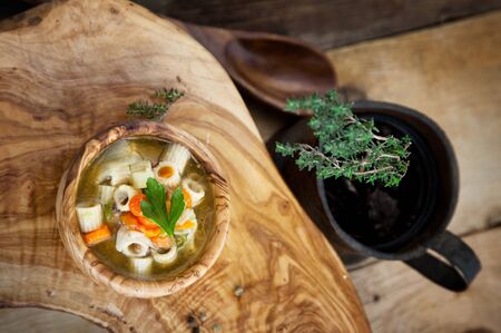 Vegetable soup with pasta and garnishの写真素材