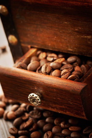 Coffee beans in the rustic old grinderの写真素材