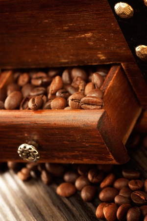 Coffee beans in the rustic old grinderの写真素材