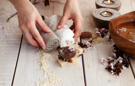 Spa and wellness manicure setting with natural soap, candles and towel  Beige dayspa nature setの写真素材
