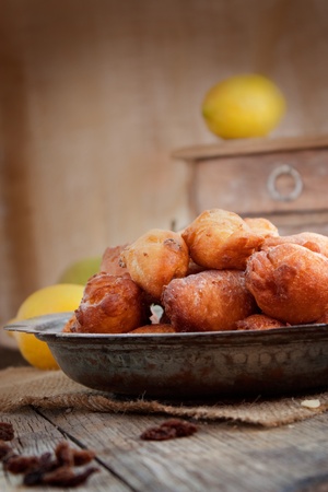 Bowl of Deep fried fritters donuts in rustic country settingの写真素材