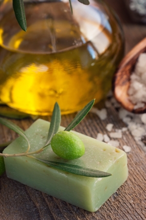 Natural spa setting with olive and olive oil products  bath salt, natural soap and olive oil の写真素材