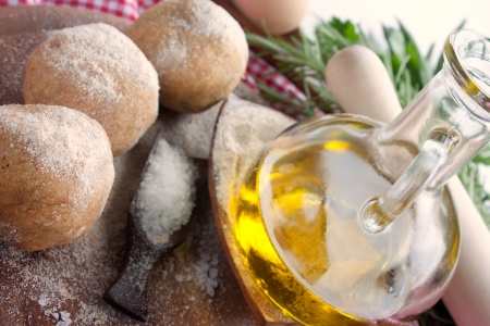 Fresh pizza dough balls with egg, olive oil, fresh herbs and salt の写真素材