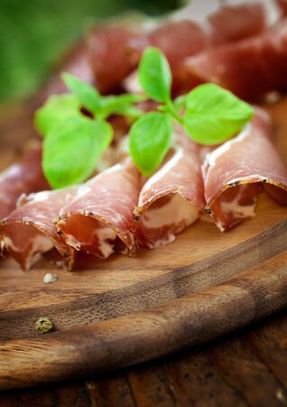 Dried pork collar salami ham with herbsの写真素材