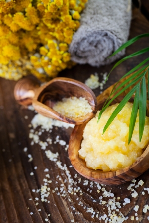 Nature yellow spa setting. Wellness theme with wildflowers and dayspa cosmetics hygiene products.の写真素材