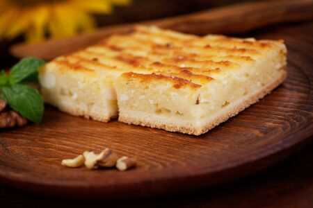 Cheese pie. Pastry cake with cheese on wooden background.の写真素材